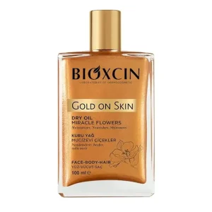 روغن مرطوب کننده و شاین صورت و بدن و مو بیوکسین مدل Gold On Skin